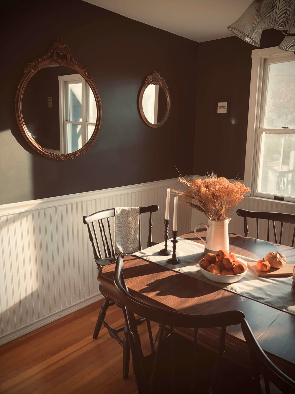 Dining room with chair rail above beadboard paneling